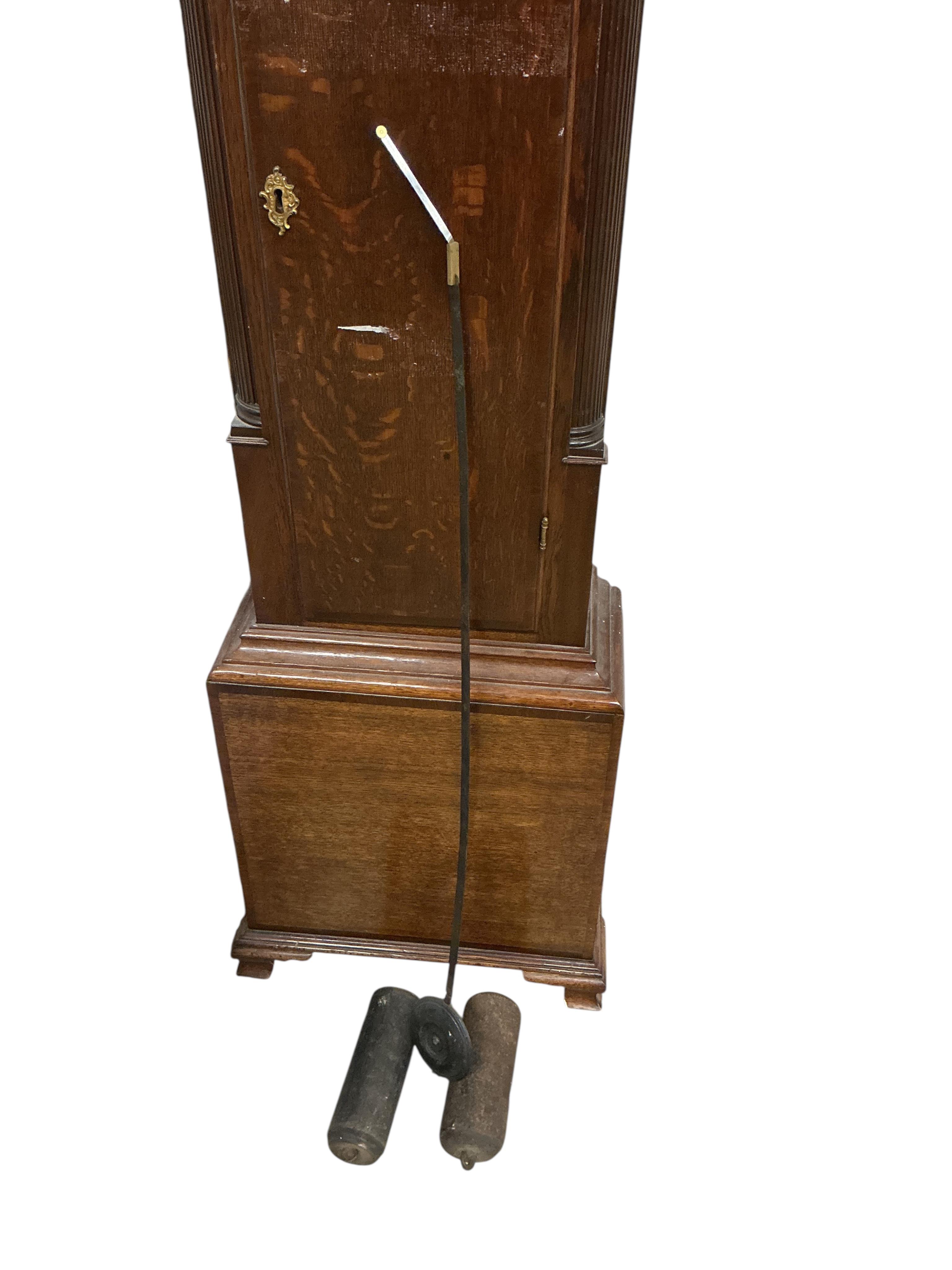 An early 19th century oak and mahogany eight day longcase clock, height 230cm